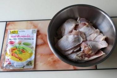 Image of chicken cut into small pieces with khao mok gai seasoning