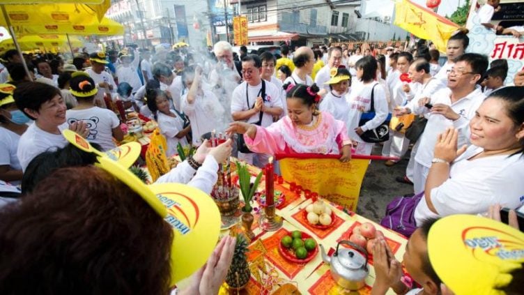 Image of white dressed Thais at vegetarian festival