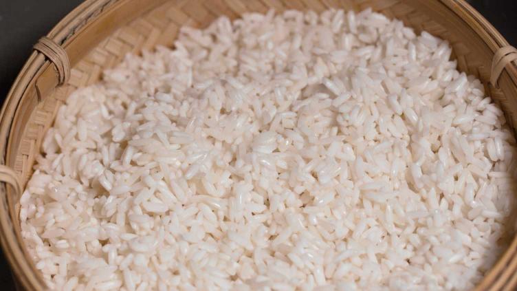 Photo of sticky rice in a purpose made bamboo steaming basket for cooking sticky rice in a rice cooker