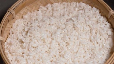 Best Way to Cook Sticky (aka Sweet) Rice in a Rice Cooker (with basket) Photo with cooked sticky rice using a rice cooker basket insert with great results