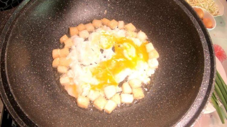 Photo of nicely browned tofu with egg ready for next ingredients making Pad Thai Shrimp