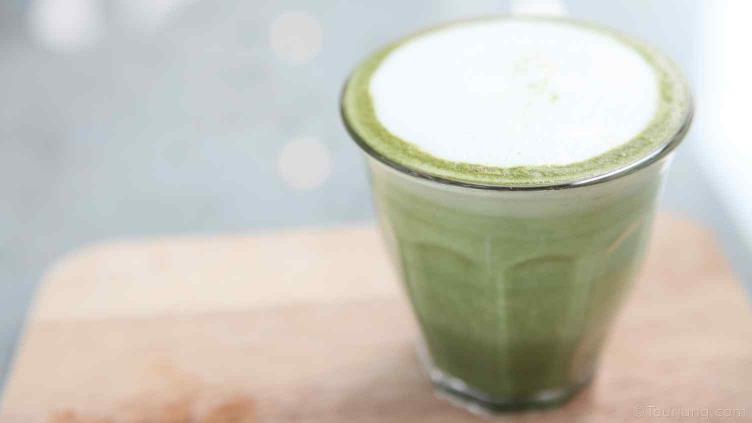 How to Make Iced Green Tea Latte with Added Matcha Powder photo of frothed milk used to top off a Matcha Green Tea drink