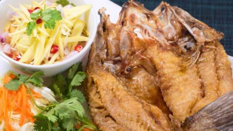 photo of perfectly deep fried sea bass with sweet fish sauce and delicious mango salad