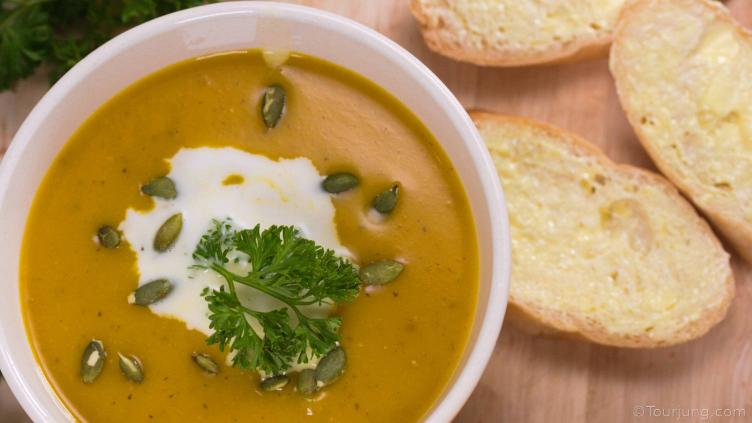 photo of pumpkin soup with bread