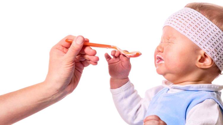 photo of baby being given tasteless food it doesn;t like