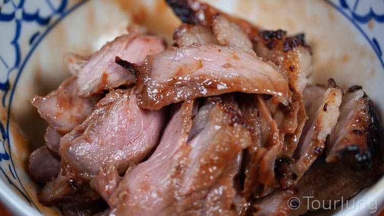 Photo of sliced rare beef after marinating and part cooking but before final cooking with salad dressing process