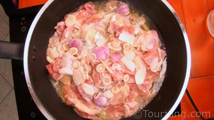 Easy & Authentic Tom Kha Gai Recipe - Thai Chicken Coconut Soup Photo of starting to cook the chicken for tom kha soup