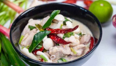 Photo of Tom Kha Gai in a black bowl for a different look