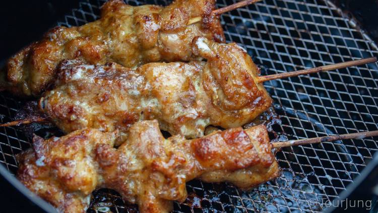 Awesome Thai Chicken Satay Skewers with Peanut Sauce Recipe - BBQ & Air Fryer Cooked Thai Street Food photo of hicken satay sticks after cooking in the air fryer