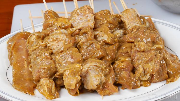 Awesome Thai Chicken Satay Skewers with Peanut Sauce Recipe - BBQ & Air Fryer Cooked Thai Street Food photo of chicken already marinated and on skewers ready for the BBQ and Air Fryer
