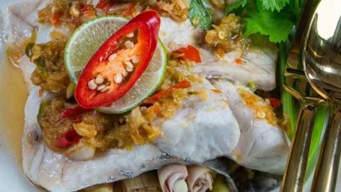 Awesome Thai Steamed Fish with Lime Sauce Recipe - Pla Krapong Neung Manao photo of Pla Krapong neung Manao