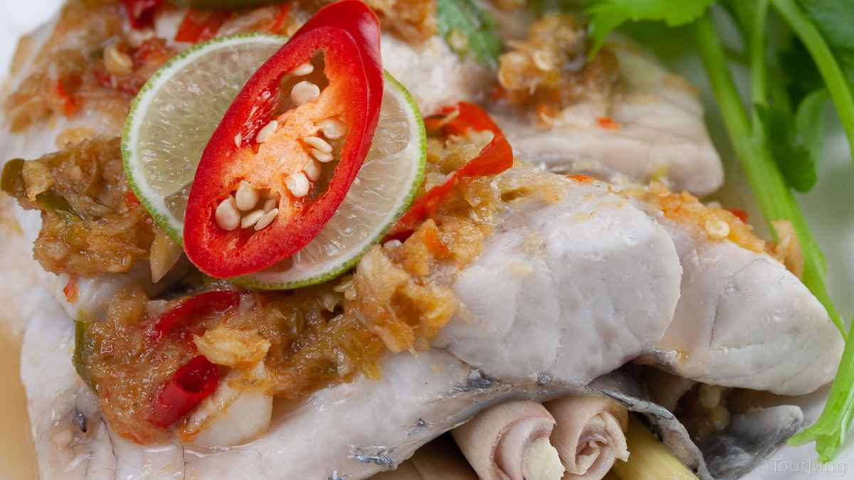 photo of delicious thai style steamed sea bass
