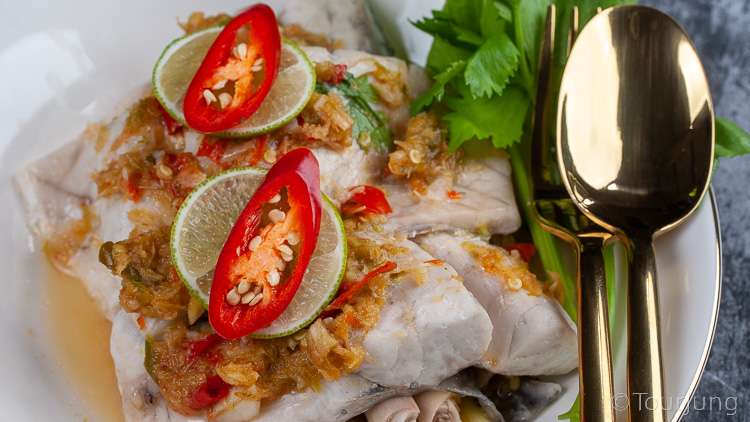Awesome Thai Steamed Fish with Lime Sauce Recipe - Pla Krapong Neung Manao photo of steamed sea bass fillet with lime sauce