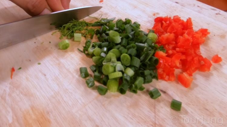 Awesome Spicy Cashews Recipe - Thai Yum Med Mamuang with Chili Photo of chopped green onion tops, kaffir lime leaf and chili for spicy cashew nut mix