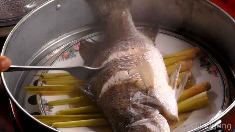 photo of whole fish in large steamer