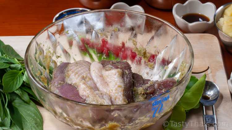 Authentic Thai Red Curry Recipe with Roast Duck - Kaeng Phed Ped Yang photo of duck breasts being marinated