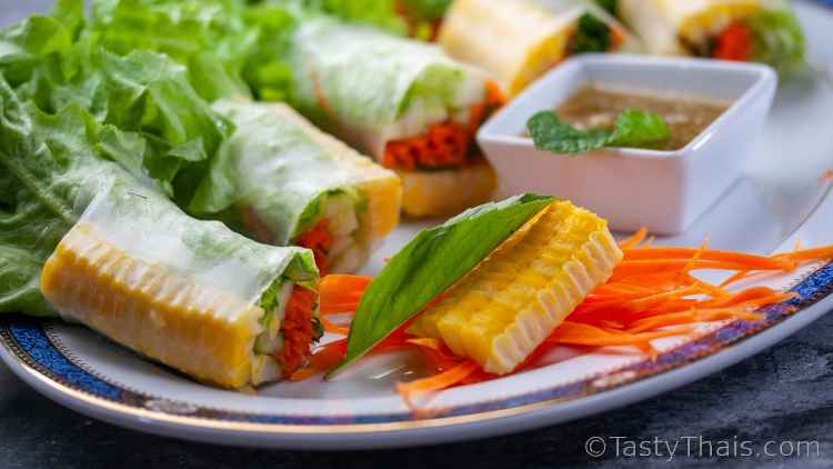 photo with a low angle showing close up of vegan spring rolls