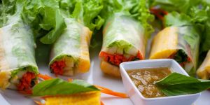 Spring rolls neatly wrapped in rice wrappers and filled with fresh and healthy vegetables all served with a piquant tasty tangy Thai dipping sauce. Sublime!