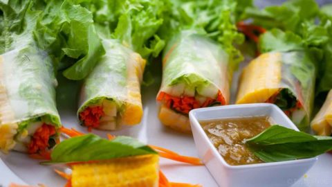 Spring rolls neatly wrapped in rice wrappers and filled with fresh and healthy vegetables all served with a piquant tasty tangy Thai dipping sauce. Sublime!