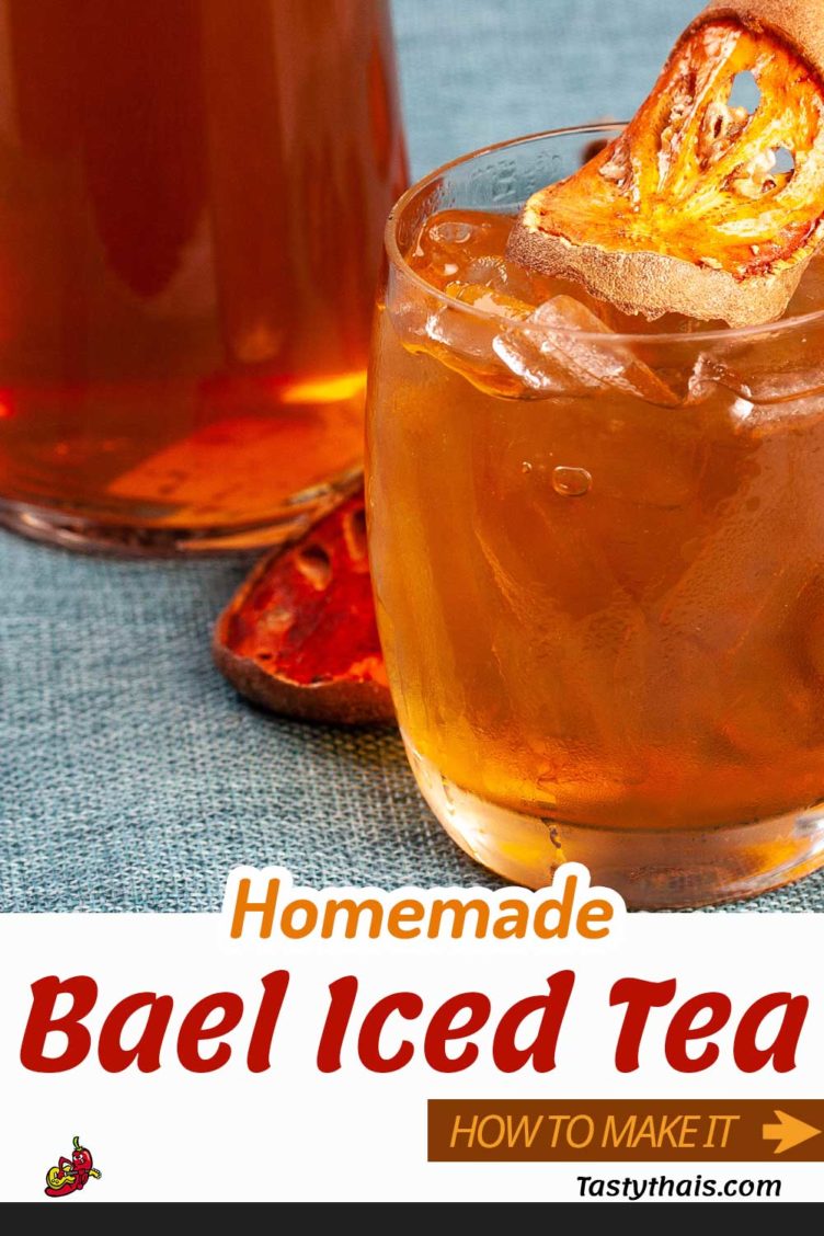 photo of iced bael fruit tea served in a glass with a pitcher of iced beal tea in the background