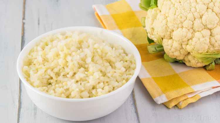 Cheesy stir fried cauliflower rice with yellow napkin