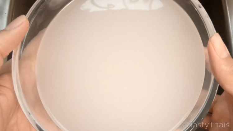 How to Cook The Best Microwave Rice in a Bowl - Thai Jasmine or White Rice photo of cloudy water from first rice wash