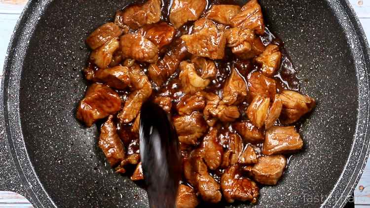 Awesomely Simple Pork Stir Fry Recipe with Egg Noodles photo of stir fried pork cooking in sauce after browning