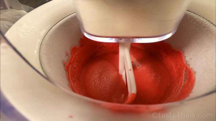 Seriously Good Homemade Strawberry Ice Cream photo of strawberry ice cream being made in an ice cream maker