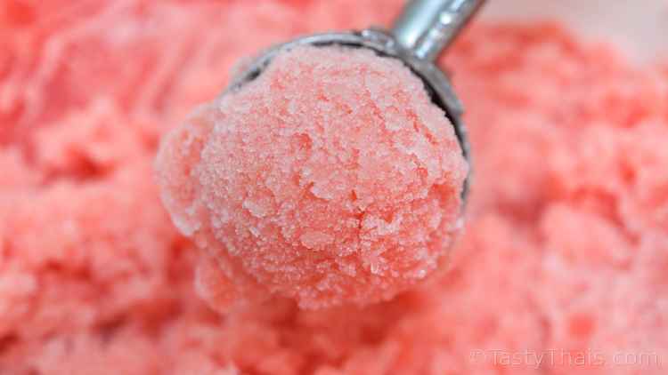 Making Homemade Ice Cream, Ice Cream Machines, Ice Cream Makers & Manual Methods Compared photo of a scoop of strawberry sorbet