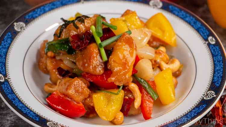 Chicken Cashew Nut Stir Fry Thai Served on a blue & white plate