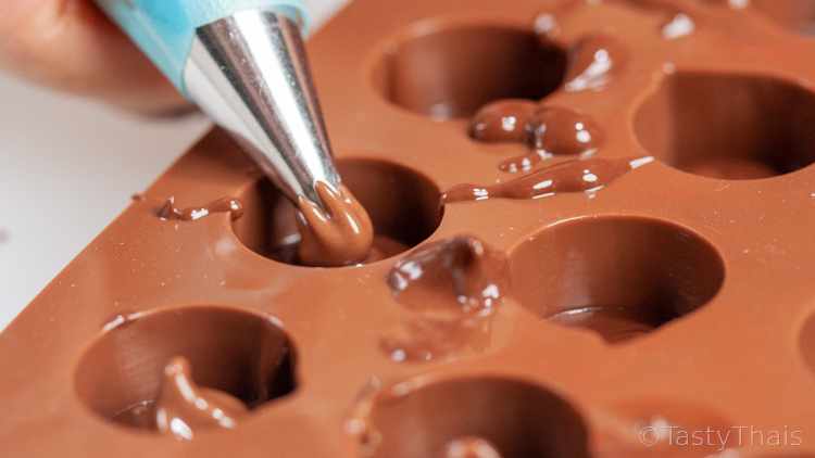 Homemade Emoji Chocolate Truffles - Family Fun Activity After lining with chocolate pipe in the Nutella chocolate spread