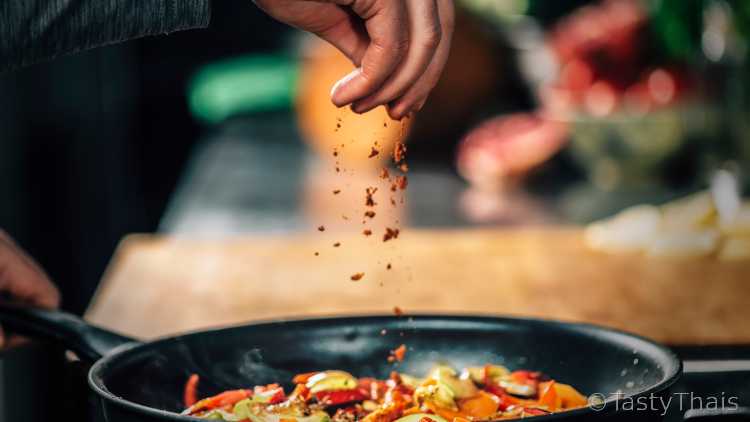 Chef using Thai seasonings with chili seasonings