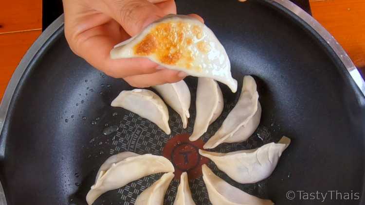 Making Gyoza wrappers, Pork Fillings & Frying Gyoza Dumplings Pan fry the gyoza to brown the bottoms before pan steaming