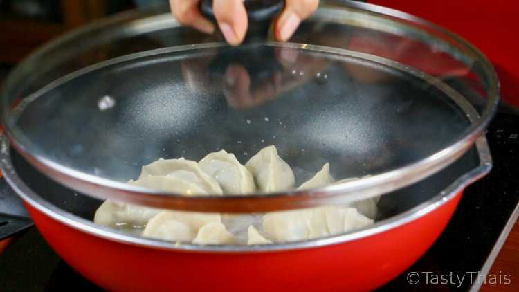 Making Gyoza wrappers, Pork Fillings & Frying Gyoza Dumplings Pan fry - Steam the gyoza in a skillet with the lid on