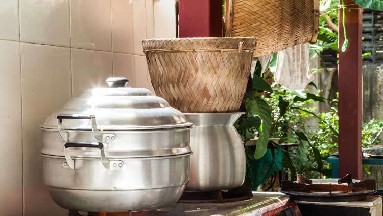 Thai Cookware image with steaming pots on a worktop