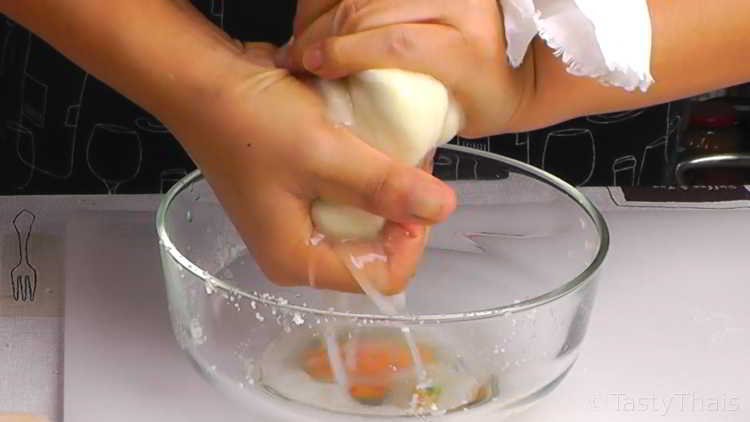 Low Carb Sushi Without Rice Wringing out the excess water from cauliflower before cooking for sushi filling