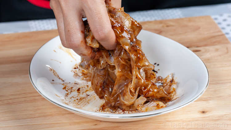 Authentic Pad See Ew Recipe - Thai Stir Fried Dark Soy Sauce Noodle Dish Separate and marinate the noodles