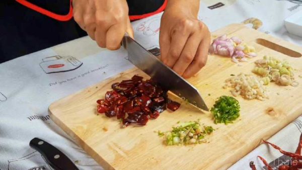 Chop the aromatics and chilies for easy processing
