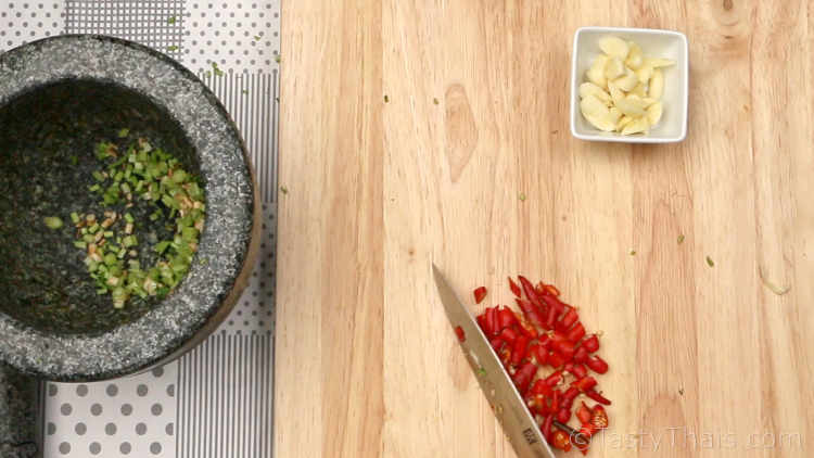 Thai Spicy Seafood Dipping Sauce (Red) - Nam Jim Seafood (sii daeng) Chopping the ingredients before pounding or blending