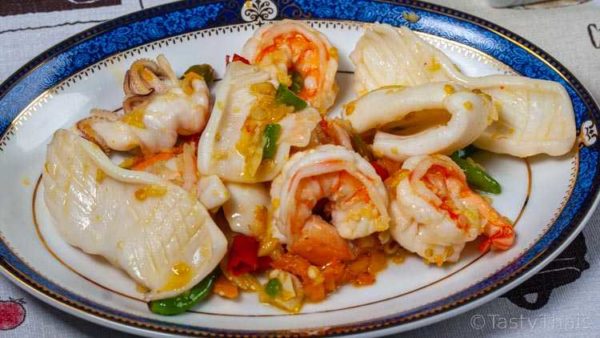 For drunken noodles stir fry the seafood or protein first to improve flavor
