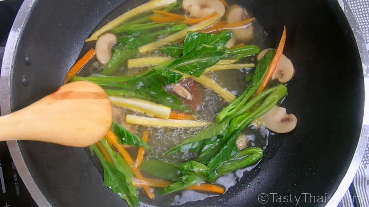Add stock to your stir fried vegetables and simmer a few minutes